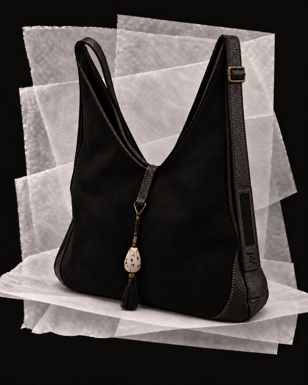 Andrea bag in Black with the Cerámica amulet, a speckled ceramic drop on a black silk tassel